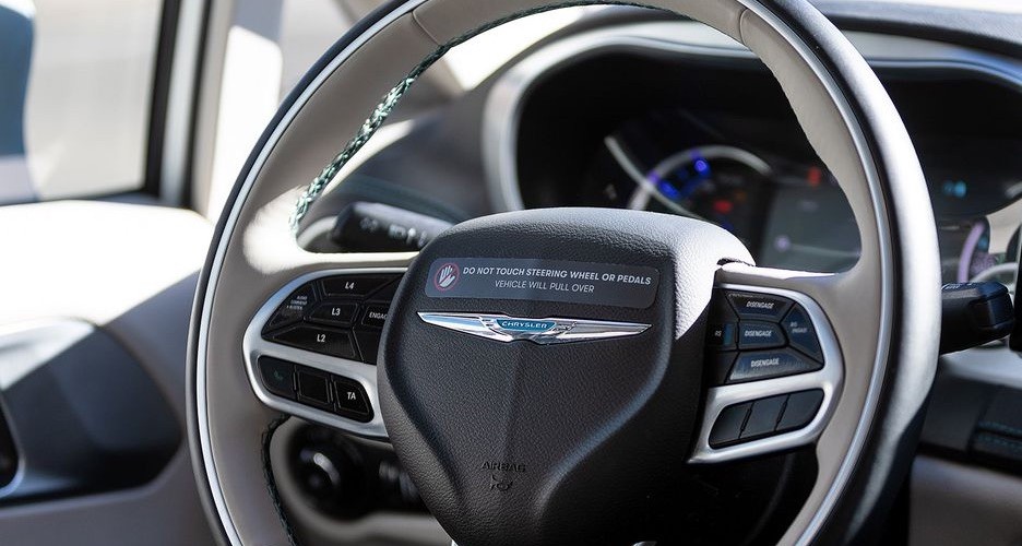 The steering wheel with the warning label